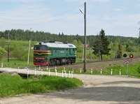 Перегон Кузнечное-Хийтола. Тепловоз М62-1669 на переезде 172 км 5 пк. Фото: Д. Верёвкин, 26.05.2015 г.